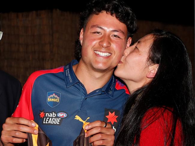 MELBOURNE, AUSTRALIA - DECEMBER 09: Connor Downie celebrates with his parents after his name is read out during the NAB AFL Draft on December 09, 2020 in Melbourne, Australia. (Photo by Michael Willson/AFL Photos via Getty Images)