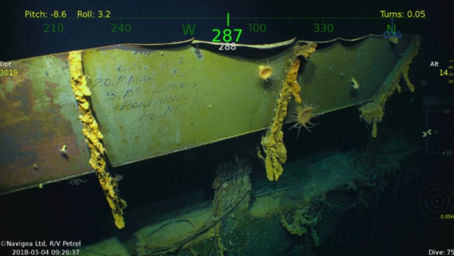 A plate of steel with writing intact among the wreckage of the USS Lexington. Picture: Vulcan