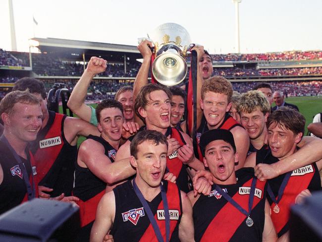 Essendon players including Thompson (far right) celebrating with the 1993 Premiership Cup. Dean Wallis.