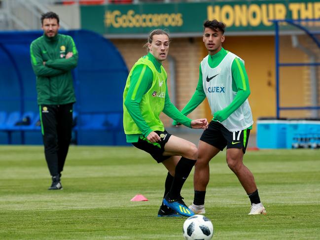 Jackson Irvine and Daniel Arzani train under the watchful eye of assistant coach Mark van Bommel at Stadium Trudovye Rezervy. Picture: Toby Zerna