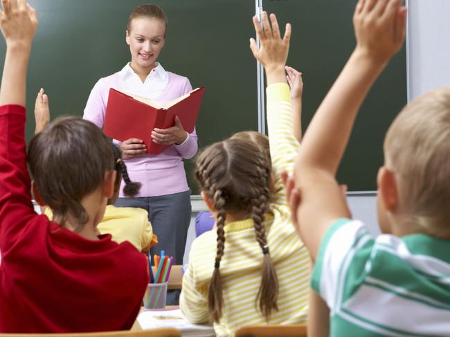 Generic image of teacher teaching students inside school classroom.