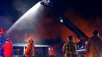 Firefighters battle a large shed fire at Logan.