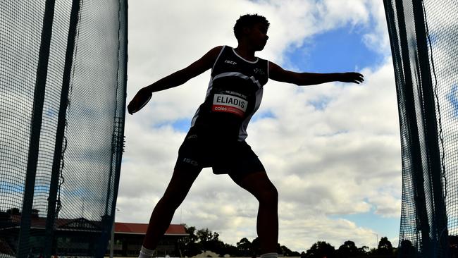 Theodore Eliadis prepares to throw in the boys U14 discus during the Australian Little Athletics Championships at Lakeside Stadium in Albert Park, Victoria on April 22, 2023.