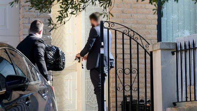 Federal officers enter the home of NSW Labor MP Shaoquett Moselmane in Rockdale, Sydney on Friday morning. Picture: Bianca De Marchi/AAP