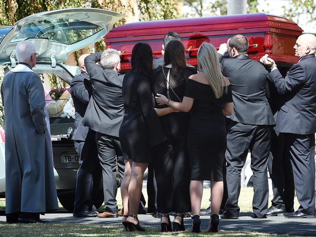 Sarah Ristevski (centre) is comforted as the coffin is carried to the waiting hearse. Picture: Nicole Garmston