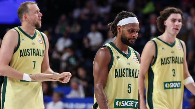 Disappointed Boomers Joe Ingles, Patty Mills and Josh Giddey leave the floor after the loss to Germany in Okinawa. Picture: Getty Images