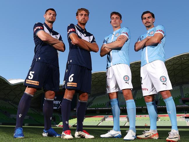 MELBOURNE, AUSTRALIA - DECEMBER 19: Brendan Hamill and Ryan Teague of the Victory pose alongside Kai Trewin and Callum Talbot of Melbourne City during a Melbourne Victory and Melbourne City A-League Derby media opportunity at AAMI Park on December 19, 2024 in Melbourne, Australia. (Photo by Morgan Hancock/Getty Images)