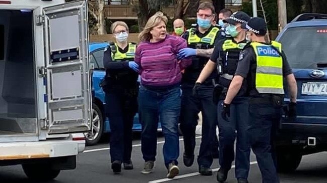 Anti-masker Mandy Crerar as she was being arrested outside a Frankston cafe.