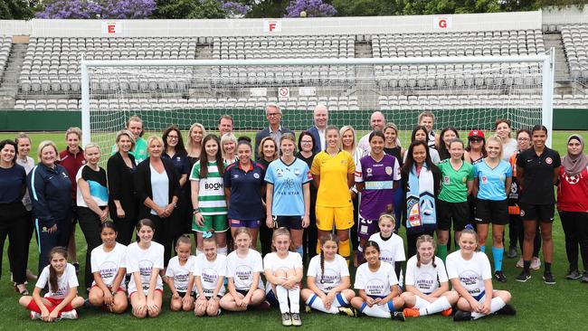 Celebrating this weekend’s Female Football round - players including Perth Glory’s Sam Kerr (purple shirt, front row), referees, coaches, junior players, FFA CEO David Gallop (back row centre) and other people of influence in women’s football. Picture: Brett Costello