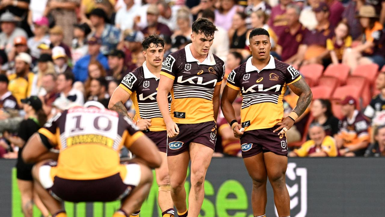 Dejected Broncos players Kotoni Staggs, Herbie Farnworth and Tesi Niu react to their first defeat of the year. Picture: Getty