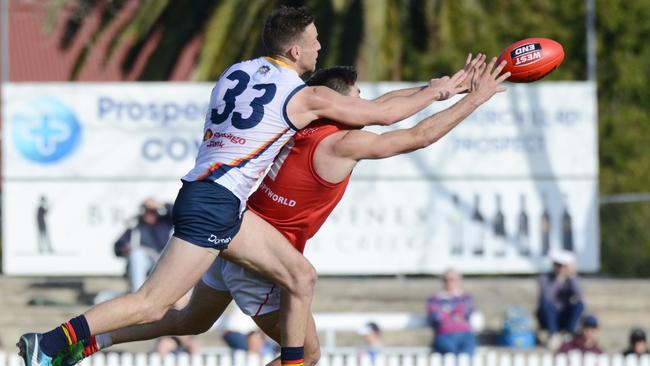 North's Aidan Tropiano is spoiled by Adelaide's Brodie Smith. Picture: Image/ Brenton Edwards