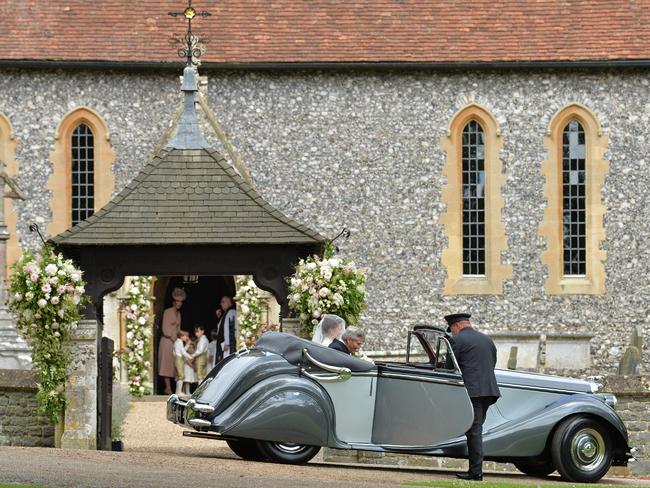 Middleton arrives as her bridesmaids gather in a doorway of the church.