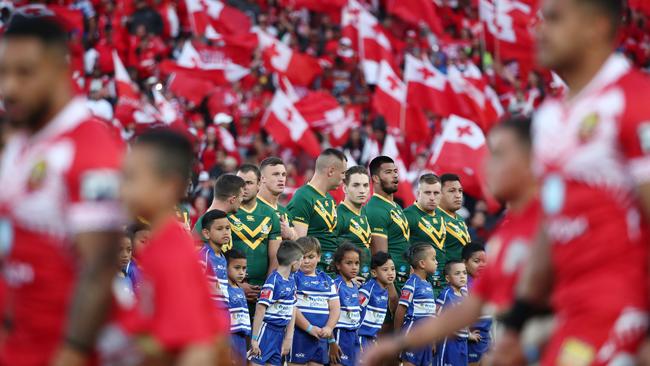 The Kangaroos lost amid a sea of red. Photo: Fiona Goodall/Getty Images