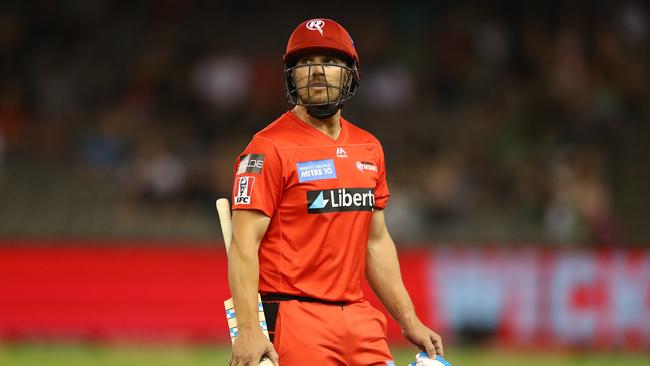 Aaron Finch of the Melbourne Renegades walks off after he was dismissed by Zahir Khan of the Stars.