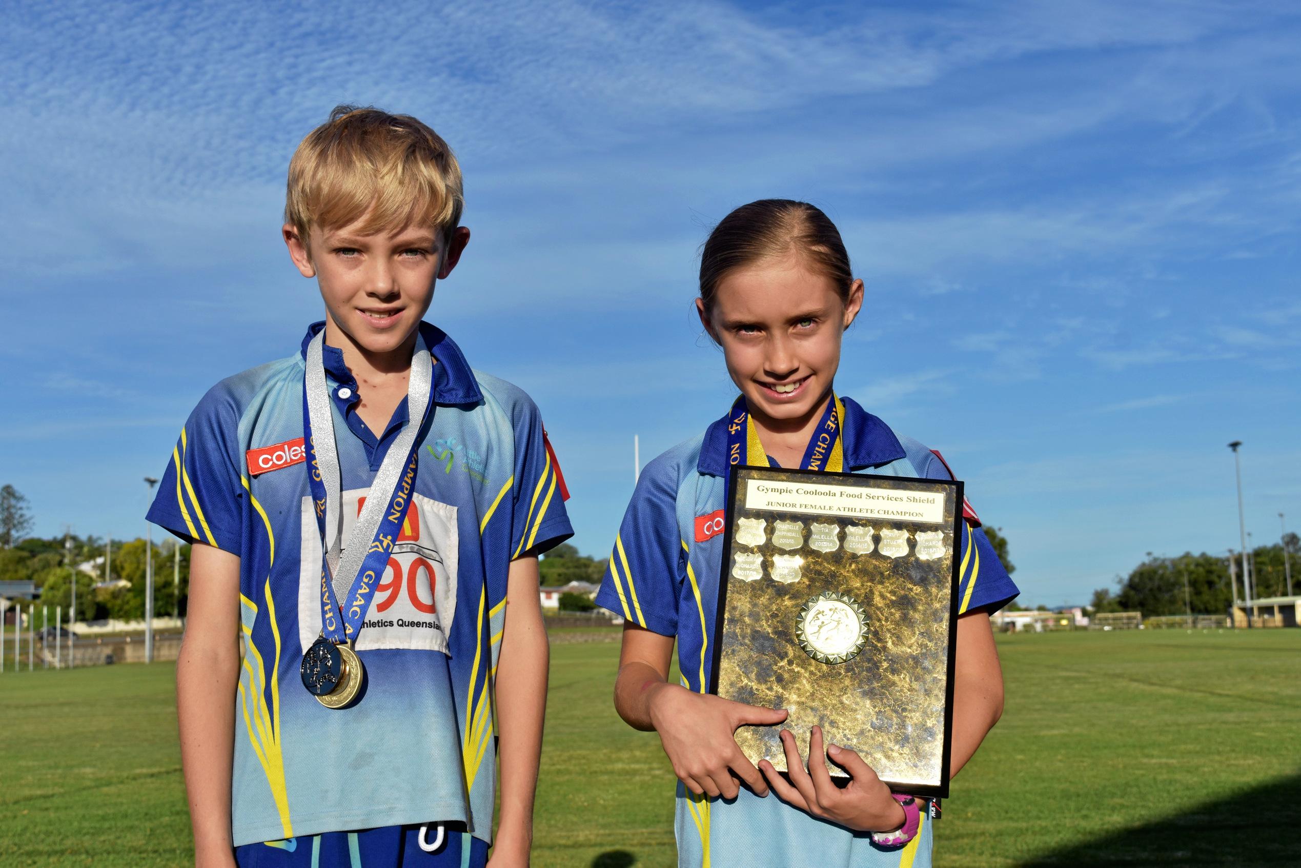 Athletics - Under 10 boys age champion Billy Merton and Under 10 girl age champion, Friday Night under 10 girls winner Cooloola Foods Shield Junior Female Athlete under 8 - under 11 under 10 winner Gemma Richards. Picture: Bec Singh