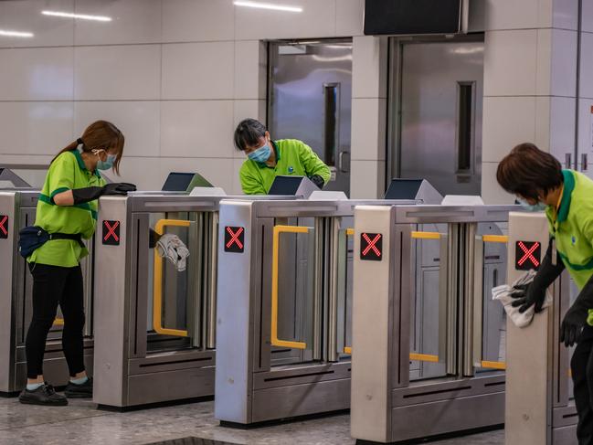 Workers cleaning gates at the arrival hall at Hong Kong High Speed Rail Station in Hong Kong, China. Picture: Anthony Kwan/Getty