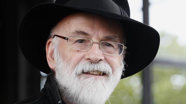 FILE - This is a Tuesday, Oct. 5, 2010 file photo of British author Terry Pratchett seen at the Conservative party conference in Birmingham, England. Fantasy writer Pratchett, creator of the “Discworld” series died Thursday March 12, 2015 aged 66. Pratchett, who suffered from a very rare form of early onset Alzheimer's disease, had earned wide respect throughout Britain with his dignified campaign for the right of critically ill patients to choose assisted suicide. (AP Photo/Kirsty Wigglesworth, File)