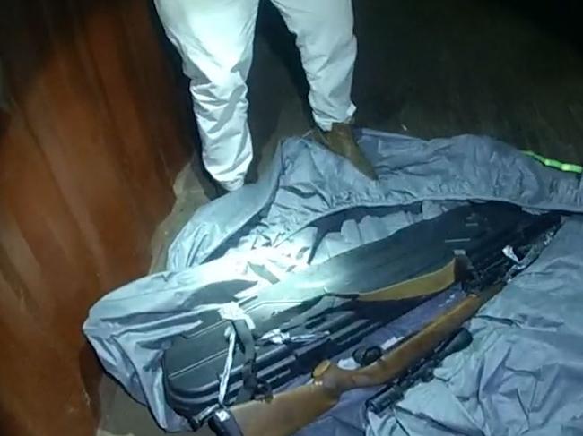 The rifle was allegedly found in a shipping container. Picture: Qld Police Service