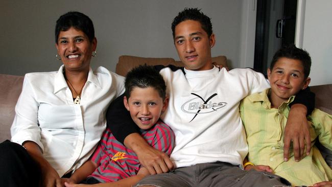 A much younger Wests Tigers footballer Benji Marshall with mother Lydia and brothers Jeremy and Jordan at their Westmead home in western Sydney.