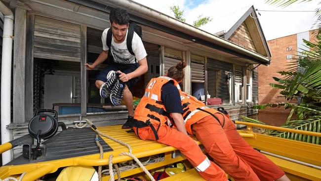 SES crews search and rescue people who were stranded in the houses in North Lismore in 2017. Picture: Marc Stapelberg