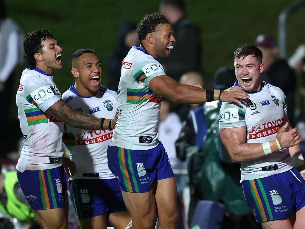 SYDNEY, AUSTRALIA - MAY 03: Hudson Young of the Raiders celebrates with team mates after scoring a try during the round nine NRL match between Manly Sea Eagles and Canberra Raiders at 4 Pines Park on May 03, 2024, in Sydney, Australia. (Photo by Mark Metcalfe/Getty Images)