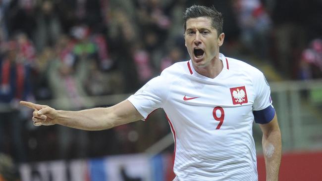 Robert Lewandowski celebrates after scoring against Denmark.