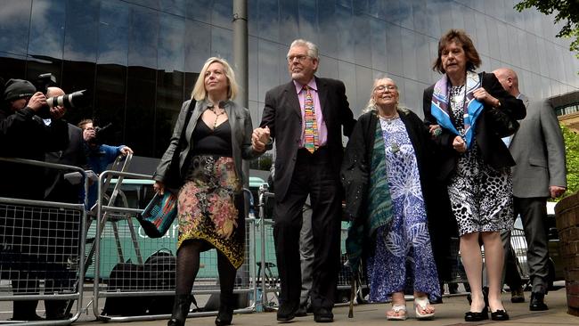 Photographers aim their cameras at Harris as he arrived at court with daughter Bindi (L), wife Alwen and niece Jenny (R). Picture: Getty Images