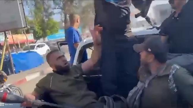 Hamas fighters were seen cheering and spitting on Shani in the clip.