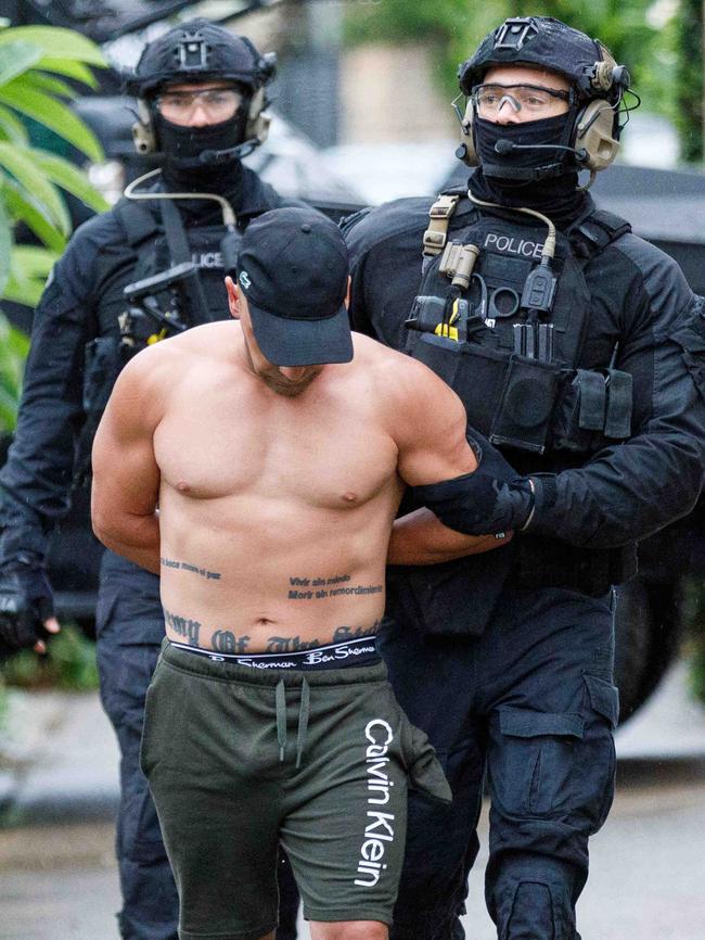 Police arrest Ayman Manly. Picture: Max Mason-Hubers