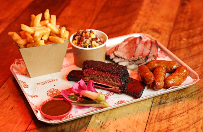 The double platter with beef short rib, smoked sausage links, Texan beef brisket, chips and sweet corn salsa.