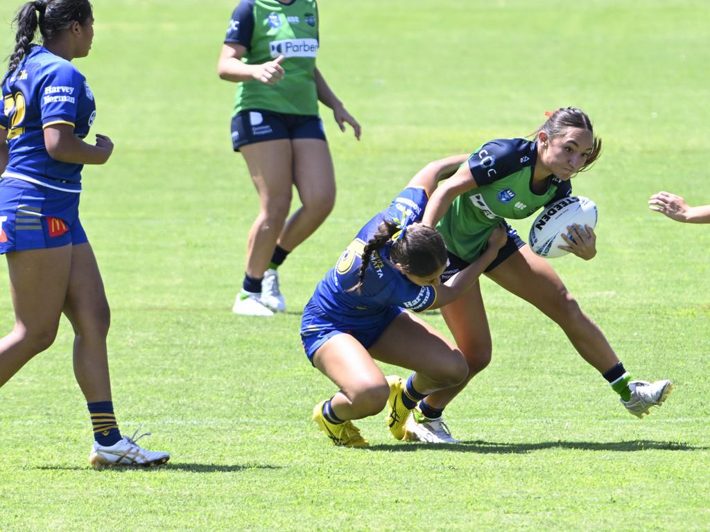 Havana Cook is tackled by Sharon Latapu. Picture: Martin Ollman