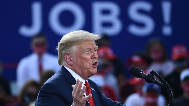 ‘Who wants to listen to Michelle Obama do a taped speech?’: Donald Trump in Oshkosh, Wisconsin, on Tuesday. Picture: AFP