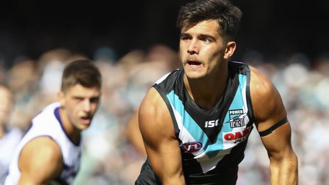 Port Adelaide defender Riley Bonner handballs against Fremantle in round one. Picture: Sarah Reed