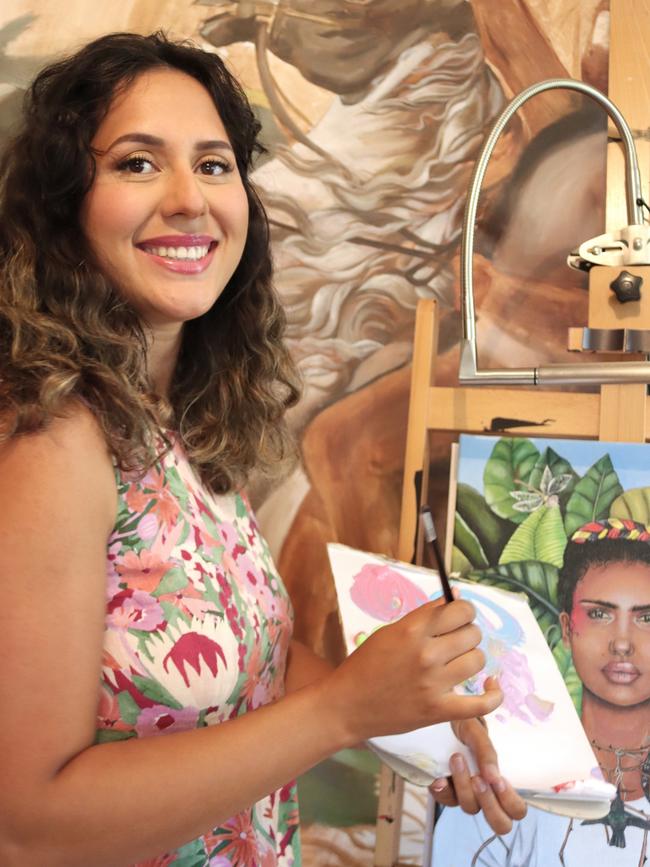 Tasmanian artist Brandi Salmon painting in her home studio. Picture: Supplied