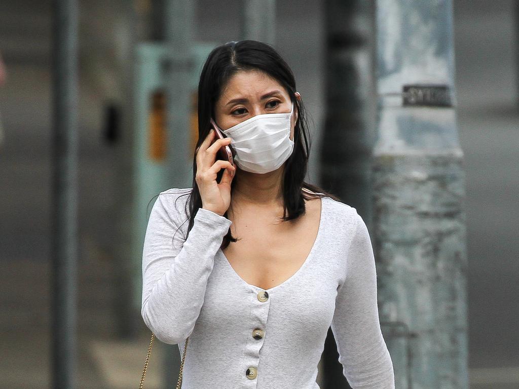 A young women in Sydney wears a face mask during the coronavirus outbreak. Picture: Matrix