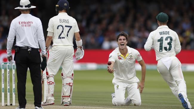 Pat Cummins of Australia celebrates after dismissing Jason Roy caught and bowled.