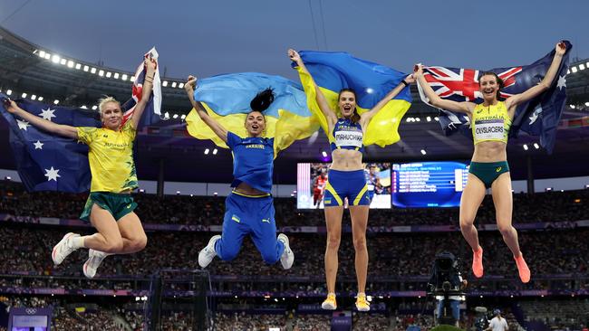 PARIS, FRANCE - AUGUST 04: (L-R) Bronze medalist Eleanor Patterson of Team Australia , Iryna Gerashchenko of Team Ukraine, Gold medalist Yaroslava Mahuchikh and Silver medalist Nicola Olyslagers of Tram Australia celebrate during the Women's High Jump Final on day nine of the Olympic Games Paris 2024 at Stade de France on August 04, 2024 in Paris, France. (Photo by Cameron Spencer/Getty Images)