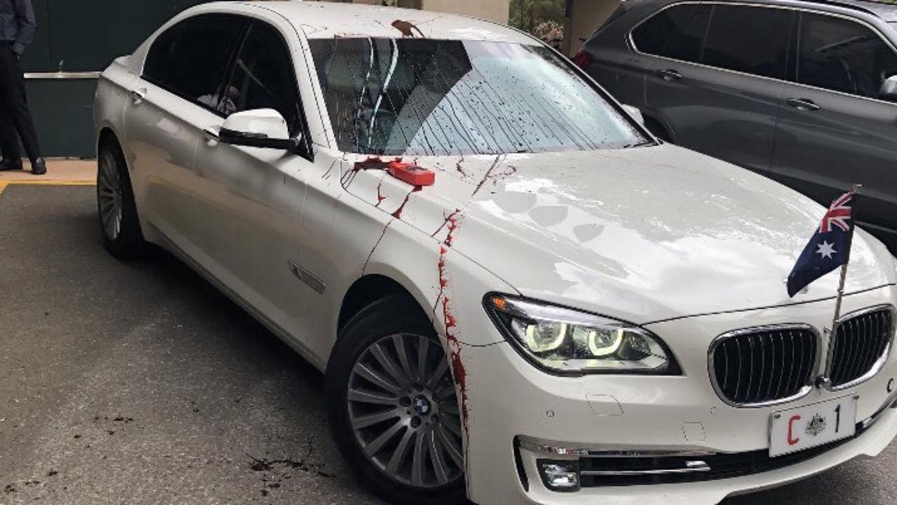 Refugee protesters have thrown red paint on Prime Minister Scott Morrison's car during his visit to the University of Queensland. Picture: Twitter via NCA NewsWire