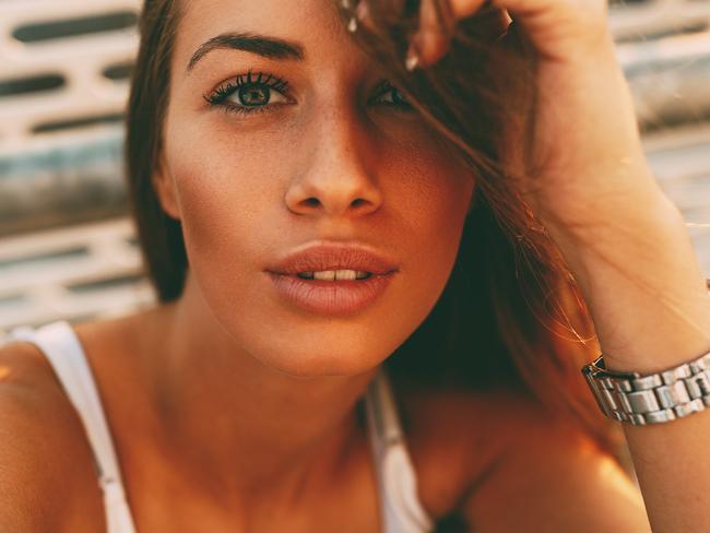 Young woman making selfie on the street