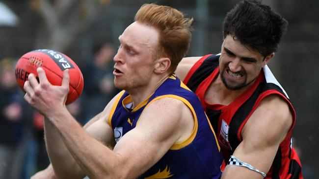 Vermont’s Matthew Willcocks is tackled during last year’s EFL Premier division Grand Final. Picture: AAP/James Ross