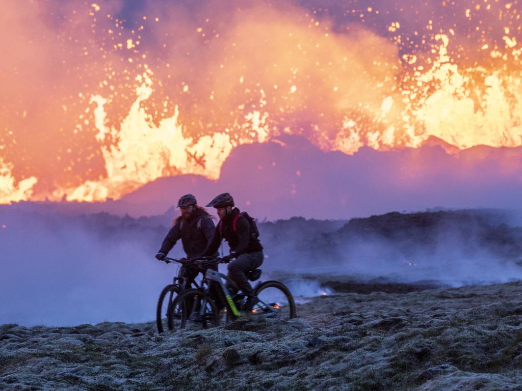 Two men on bikes are seen examining the site. Picture: Emin Yogurtcuoglu/Anadolu Agency via Getty Images