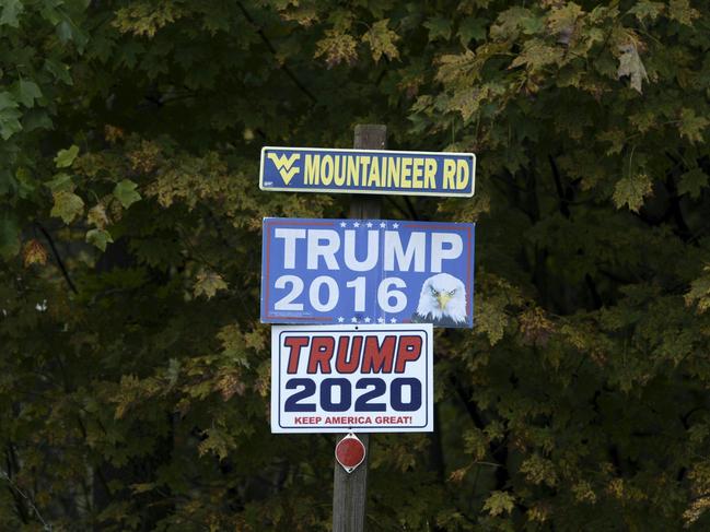 Campaign signs are seen along a road in West Virginia,. Impoverished Appalachia is a culturally conservative bastion on edge, ground zero in an opioid abuse crisis that has devastated families, and where wages are stagnant, health care costs are rising and the coal industry is gasping for air. Picture: AFP