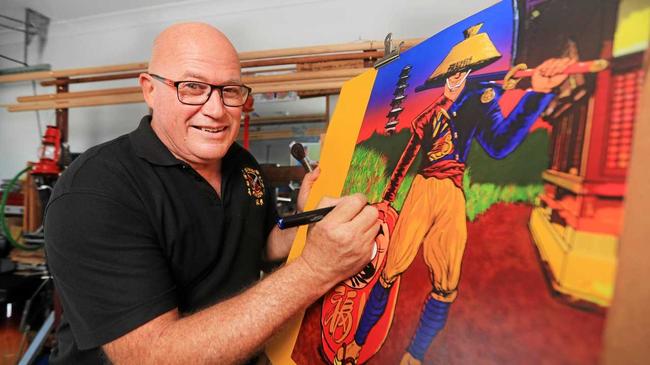 Murwillumbah artist David Lovegrove with some of his vibrant work. Picture: Scott Powick