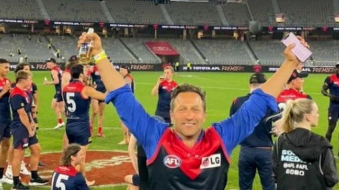 Mr Burbank on the ground at Optus Stadium after Melbourne’s victory.