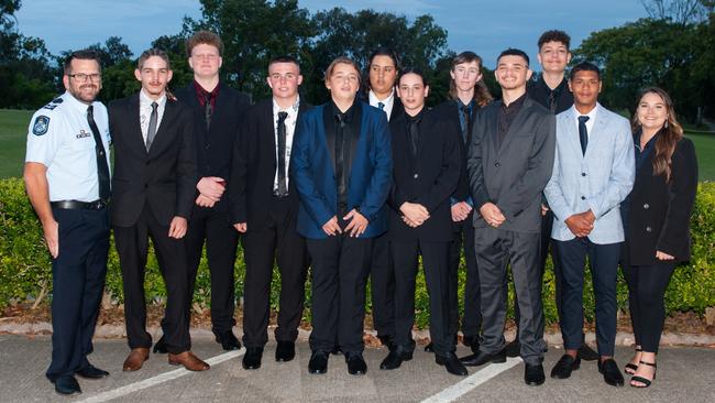 Senior Constable Keiran Horsfall, Javaya Doyle, Cooper Linning, Lucas Temple, Jake Henderson, Andrew Cole, Zeth Southgate, Dylan Blaik, Darius Ramsamy, Lockie Turner, Zebby Boah, youth support officer Danica Crebbin at the Project Booyah Mackay graduation 2022. Picture: Michaela Harlow