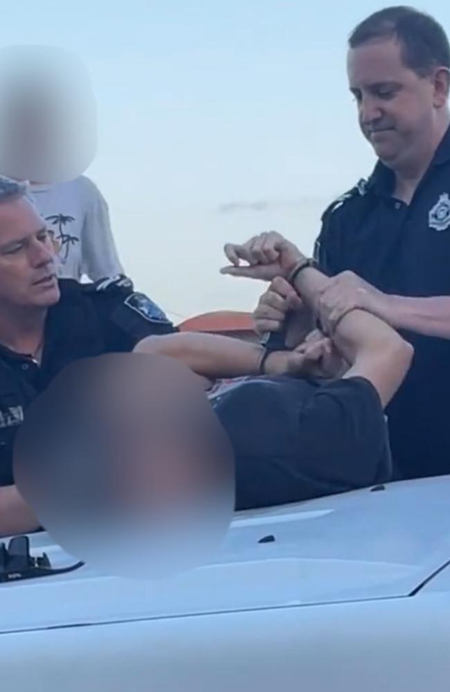 The young driver was handcuffed over the bonnet of a car. Picture: Tik Tok