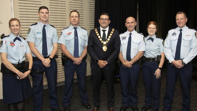 Parramatta Lord Mayor Steven Issa, centre, recognises police at the festivities.