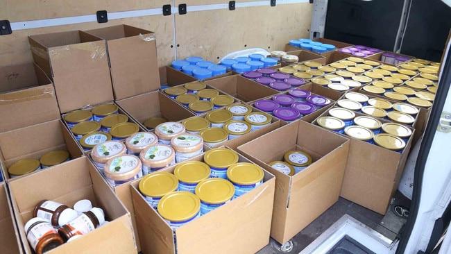 Some of the 1306 baby formula tins seized by cops. Picture: NSW Police