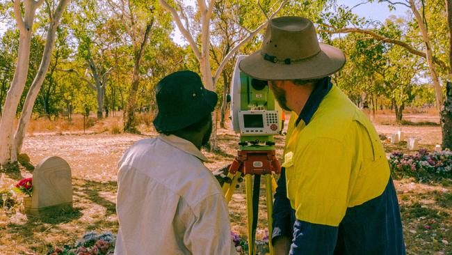 Isaac Pamkal and Jordan Ralph use a total station to survey the entirety of Barunga cemetery. PICTURE: Dylan Benedetto