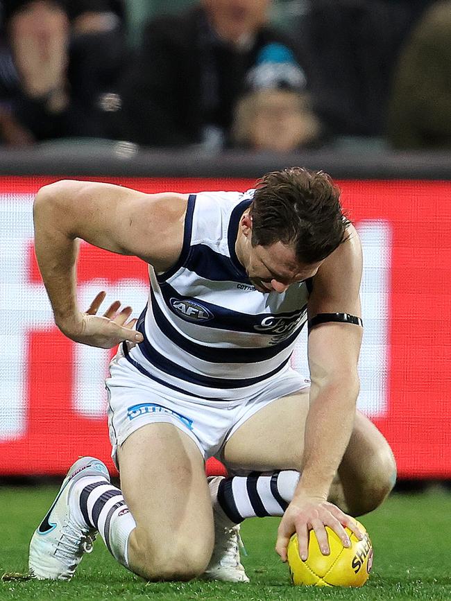 Dangerfield in pain after the marking contest. Picture: Sarah Reed/AFL Photos via Getty